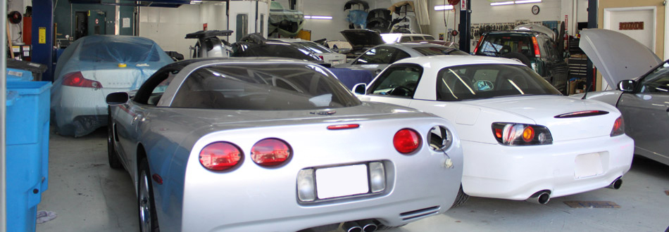 The Garage SF - Cars waiting inside the shop.
